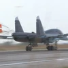 Máy bay Sukhoi trở về căn cứ Latakia sau khi không kích mục tiêu IS. (Nguồn: RT)