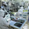 Sản xuất linh kiện điện tử tại Công ty trách nhiệm hữu hạn Mtex Việt Nam (Thành phố Hồ Chí Minh). (Ảnh: Thanh Vũ/TTXVN)