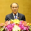 Chủ tịch Quốc hội Nguyễn Sinh Hùng trình bày dự thảo Báo cáo công tác nhiệm kỳ khóa XIII của Quốc hội. (Ảnh: Nhan Sáng/TTXVN)