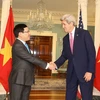 Phó Thủ tướng, Bộ trưởng Ngoại giao Phạm Bình Minh hội đàm với Ngoại trưởng Mỹ J.Kerry . (Ảnh: Thanh Tuấn/TTXVN)