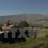 Xe tăng Israel trên vùng đất chiếm đóng của Cao nguyên Golan, giáp giới với làng Hadar của Syria ngày 17/4. (Nguồn: AFP/TTXVN)