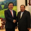 Tổng Bí thư, Chủ tịch nước Lào Bounnhang Volachit tiếp Bí thư Thành ủy TP.HCM Đinh La Thăng. (Ảnh: Phạm Kiên/TTXVN) 