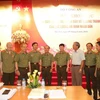Lãnh đạo Bộ Công an, Tổng cục An ninh chụp ảnh lưu niệm tại hội thảo khoa học 70 năm xây dựng, chiến đấu và trưởng thành của lực lượng an ninh nhân dân. (Ảnh: Quang Vũ/Vietnam+) 
