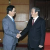 Thường trực Ban Bí thư Đinh Thế Huynh tiếp ông Hồng Tiểu Dũng, Đại sứ đặc mệnh toàn quyền Trung Quốc tại Việt Nam. (Ảnh: Phạm Kiên/TTXVN) 