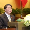 Chủ nhiệm Ủy ban Tài chính và Ngân sách của Quốc hội Nguyễn Đức Hải trình bày báo cáo tại phiên họp. (Ảnh: Phương Hoa/TTXVN)