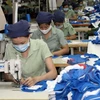 Xưởng may quần áo của Công ty Dệt May 7 - doanh nghiệp Nhà nước thuộc Quân khu 7, Bộ Quốc phòng. (Ảnh: Trọng Đức/TTXVN)