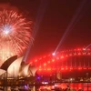 Màn pháo hoa lung linh rực rỡ sắc màu trên cầu cảng Sydney, Australia ngày 31/12. (Nguồn: AFP/TTXVN)