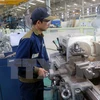 Công nhân sản xuất cơ khí ôtô tại Khu kinh tế mở Chu Lai. (Ảnh: Đỗ Trưởng/TTXVN)