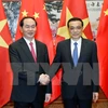 Chủ tịch nước Trần Đại Quang gặp Thủ tướng Trung Quốc Lý Khắc Cường. (Ảnh: Nhan Sáng/TTXVN) 