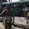 Binh sỹ Afghanistan điều tra tại hiện trường một vụ tấn công. (Nguồn: AFP/TTXVN)