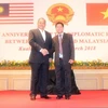 Bộ trưởng Văn phòng Chính phủ Malaysia Shahidan bin Kassim và Đại sứ Lê Quý Quỳnh. (Ảnh: Hoàng Nhương/Vietnam+)
