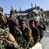 Các lực lượng dân chủ Syria (SDF) tại Raqa (Syria). (Nguồn: AFP/TTXVN)