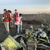 Lực lượng cứu hộ làm nhiệm vụ tại hiện trường vụ rơi máy bay của hãng hàng không Ethiopian Airlines ở cách thủ đô Addis Ababa của Ethiopia 50km về phía đông, ngày 10/3/2019. (Ảnh: THX/TTXVN)
