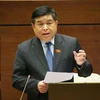Bộ trưởng Bộ Kế hoạch và Đầu tư Nguyễn Chí Dũng giải trình, làm rõ một số vấn đề đại biểu Quốc hội nêu. (Ảnh: Doãn Tấn/TTXVN)