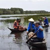 Trải nghiệm "một ngày làm ngư dân" tại vườn quốc gia Tràm Chim ở huyện Tam Nông, tỉnh Đồng Tháp. (Ảnh: Chương Đài/TTXVN)
