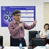 Giám đốc Sở Khoa học và Công nghệ Thành phồ Hồ Chí Minh Nguyễn Việt Dũng trao đổi các nội dung định hướng xây dựng Trung tâm. (Ảnh: Tiến Lực/TTXVN)