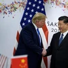 Tổng thống Mỹ Donald Trump (trái) và Chủ tịch Trung Quốc Tập Cận Bình trong cuộc hội đàm bên lề Hội nghị thượng đỉnh G20 tại Osaka, Nhật Bản, ngày 29/6/2019. (Ảnh: AFP/TTXVN)