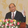 Thủ tướng Nguyễn Xuân Phúc phát biểu tại hội nghị. (Ảnh: Thanh Tùng/TTXVN)