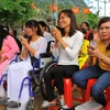Niềm vui của người khuyết tật trong ngày kỷ niệm Ngày Quốc tế Người khuyết tật ở Ninh Bình. (Ảnh: Minh Đức/TTXVN)