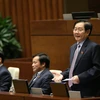 Bộ trưởng Bộ Nội vụ Lê Vĩnh Tân trả lời chất vấn các câu hỏi của đại biểu Quốc hội. (Ảnh: Dương Giang/TTXVN)