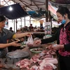 Thịt lợn tại Hà Nội đã có xu hướng giảm. (Ảnh: Thanh Thương/TTXVN)