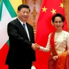 Chủ tịch Trung Quốc Tập Cận Bình và Cố vấn Nhà nước Myanmar Aung San Suu Kyi. (Ảnh: Reuters)