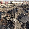 Hiện trường vụ rơi máy bay chở khách của Hãng hàng không quốc tế Ukraine ở gần Tehran, Iran ngày 8/1. (Ảnh: AFP/TTXVN)