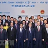 Thủ tướng Nguyễn Xuân Phúc cùng các đại biểu tại diễn đàn Doanh nghiệp Việt Nam-Hàn Quốc tháng 11/2019. Ảnh minh họa. (Ảnh: Thống Nhất/TTXVN)