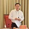 Bí thư Thành ủy Hà Nội Vương Đình Huệ chủ trì hội nghị. (Nguồn: TTXVN)