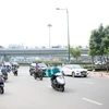 Cầu vượt dạng chữ N tại nút giao Nguyễn Thái Sơn-Nguyễn Kiệm giúp giao thông lối ra vào sân bay Tân Sơn Nhất được thông thoáng. (Ảnh: Tiến Lực/TTXVN)