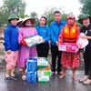 Các suất quà cứu trợ đã được trao tận tay bà con vùng lũ ở Quảng Bình. (Ảnh: Võ Dung/TTXVN)