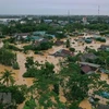 Hình ảnh lũ lớn trên sông Hiếu gây ngập diện rộng tại khu vực huyện Cam Lộ, tỉnh Quảng Trị. (Ảnh: Hồ Cầu/TTXVN)