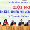 Thủ tướng Nguyễn Xuân Phúc và lãnh đạo Ngân hàng Nhà nước Việt Nam chủ trì hội nghị. (Ảnh: Thống Nhất/TTXVN)