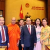 Thủ tướng Nguyễn Xuân Phúc và các đại biểu Quốc hội dự khai mạc kỳ họp lần thứ 11. (Ảnh: Thống Nhất/TTXVN)
