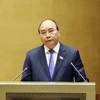 Thủ tướng Nguyễn Xuân Phúc trực tiếp trả lời các câu hỏi của đại biểu Quốc hội. (Ảnh: Thống Nhất/TTXVN) 