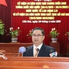 Chủ tịch UBND thành phố Cần Thơ Trần Việt Trường đọc diễn văn tại buổi họp mặt. (Ảnh: Ngọc Thiện/TTXVN)