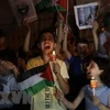 Trẻ em tại thành phố Nablus, Bờ Tây, tham gia tuần hành bày tỏ ủng hộ với người Palestine ở Dải Gaza. (Ảnh: THX/TTXVN) 