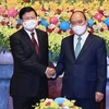 Chủ tịch nước Nguyễn Xuân Phúc hội kiến Tổng Bí thư, Chủ tịch nước Lào Thongloun Sisoulith. (Ảnh: Thống Nhất/TTXVN) 