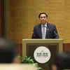 Thủ tướng Chính phủ nhiệm kỳ 2016-2021 Phạm Minh Chính trình bày Báo cáo giải trình, tiếp thu ý kiến của đại biểu Quốc hội về cơ cấu tổ chức của Chính phủ nhiệm kỳ 2021-2026. (Ảnh: Dương Giang/TTXVN) 