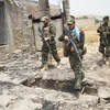 Lực lượng an ninh Afghanistan tham gia chiến dịch truy quét các tay súng Taliban tại Alishing, tỉnh Laghman. (Ảnh: THX/TTXVN) 