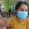 Cư dân các xã, phường biên giới của thành phố Móng được tiêm vaccine phòng COVID-19 mũi 2. (Ảnh: Thanh Vân/TTXVN) 