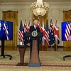 Trong ảnh (từ trái sang): Thủ tướng Australia Scott Morrison, Tổng thống Mỹ Joe Biden và Thủ tướng Anh Borris Johnson trong cuộc họp báo trực tuyến về an ninh quốc gia, ngày 15/9. (Ảnh: AFP/TTXVN)