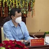 Giám đốc Bệnh viện Chợ Rẫy Nguyễn Tri Thức hỗ trợ tư vấn tại buổi làm việc. (Ảnh: Hồng Đạt/TTXVN)