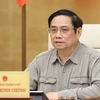 Thủ tướng Phạm Minh Chính chủ trì cuộc họp Ban Chỉ đạo Quốc gia phòng, chống dịch COVID-19. (Ảnh: Dương Giang/TTXVN) 