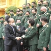 Chủ tịch nước Nguyễn Xuân Phúc gặp mặt đoàn đại biểu doanh nhân là các cựu chiến binh Việt Nam. (Ảnh: Lâm Khánh/TTXVN) 