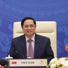 Thủ tướng Phạm Minh Chính dự Hội nghị cấp cao ASEAN-Ấn Độ lần thứ 18 theo hình thức trực tuyến tại điểm cầu Hà Nội. (Ảnh: Dương Giang/TTXVN) . 