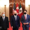 Tổng thống Mexico Lopez Obrador (trái), Tổng thống Mỹ Joe Biden (giữa) và Thủ tướng Canada Justin Trudeau tại Hội nghị thượng đỉnh ba bên ở Washington DC., ngày 18/11. (Ảnh: AFP/TTXVN)