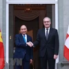 Chủ tịch nước Nguyễn Xuân Phúc và Tổng thống Liên bang Thụy Sỹ Guy Parmelin. (Ảnh: Thống Nhất/TTXVN) 
