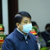 Cựu Chủ tịch Ủy ban Nhân dân thành phố Hà Nội Nguyễn Đức Chung khai báo trước tòa. (Ảnh: TTXVN) 
