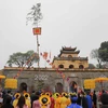 Cây nêu ngày Tết được dựng trong khu di sản thế giới Hoàng Thành Thăng Long. (Ảnh: Thanh Tùng/TTXVN)